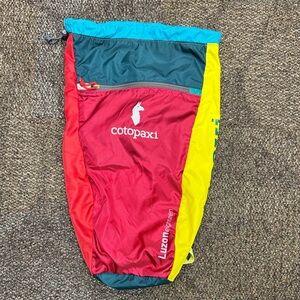 Cotopaxi Luzon 18 L Daypack in Vibrant Red, Yellow, and Teal